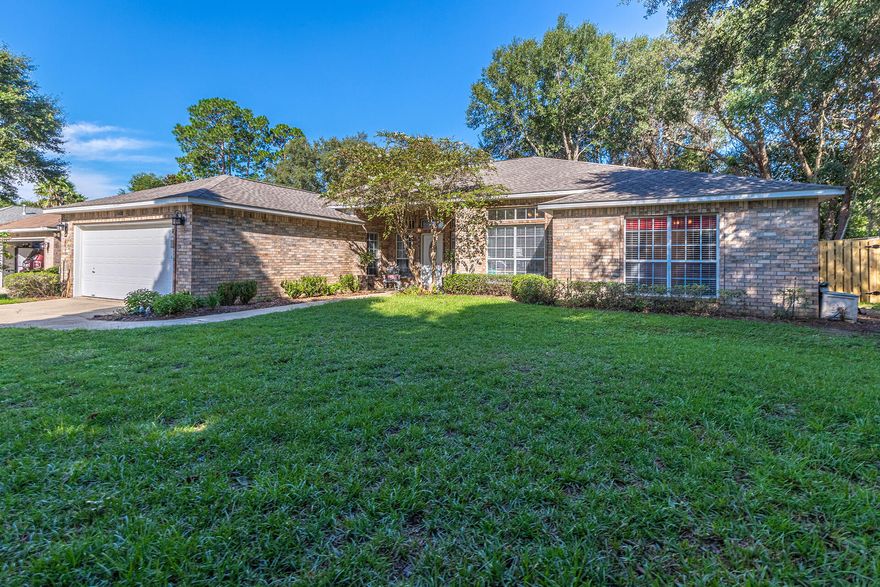 Beautifully REMODELED 4 bedroom, 3 bath home located in a quiet cul-de-sac in the GATED community of Magnolia Plantation. This 1 story home has a newly renovated eat-in kitchen which features GRANITE countertops STAINLESS STEEL appliance package w/ GAS STOVE, and CUSTOM white Kraftmaid soft close cabinetry.Brand new PERGO FLOORING throughout the main areas of the home and NEW CARPET in the bedrooms. 2 LIVING ROOMS with a cozy fireplace, and a separate formal dining room/den that could easily be transformed into a beautiful private office!Spacious primary bedroom with en-suite bath features a double vanity, large soaking tub, separate shower and water closet.3 total additional bedrooms, 2 of which are adjoined by an adorable Jack & Jill bathroom. The backyard has a brand