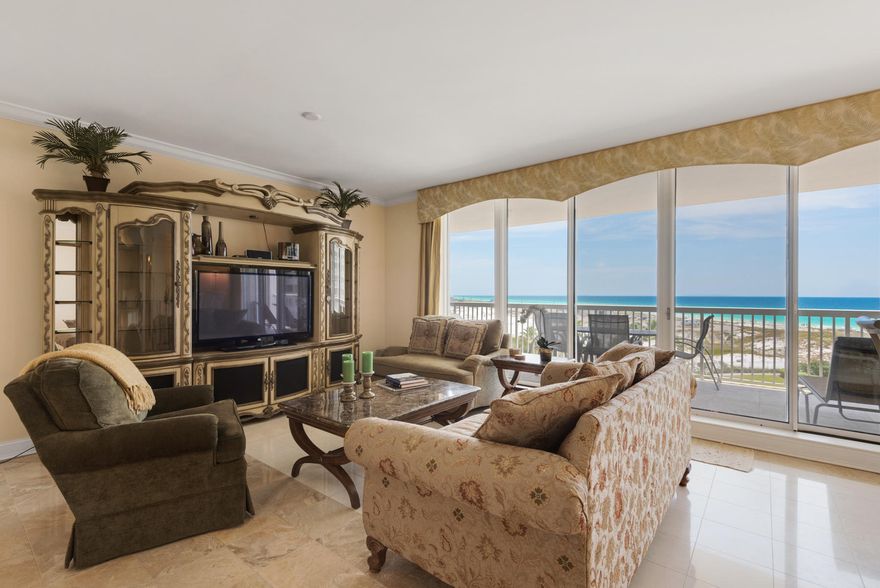 Gorgeous 5th floor, fully furnished and updated, 2 bedroom 2 1/2 bath condo providing beautiful views of Henderson Beach State Park and the Gulf of Mexico. Upgrades include travertine tile in the common areas & bathrooms and granite counter tops throughout. The Master Suite has a large walk-in closet with fabulous custom built-ins and the bath contains double vanities, a Jacuzzi tub, and a separate walk-in shower. Enjoy endless unobstructed views from the expansive terrace that can be accessed from every room in the condo. St. Barth is bordered by Henderson Beach State Park, which provides miles of unobstructed views down the coastline. St. Barth is a short term rental restricted building with lovely lobby, private pool and hot tub, expansive lanai terrace with grill and picnic area,cont'd