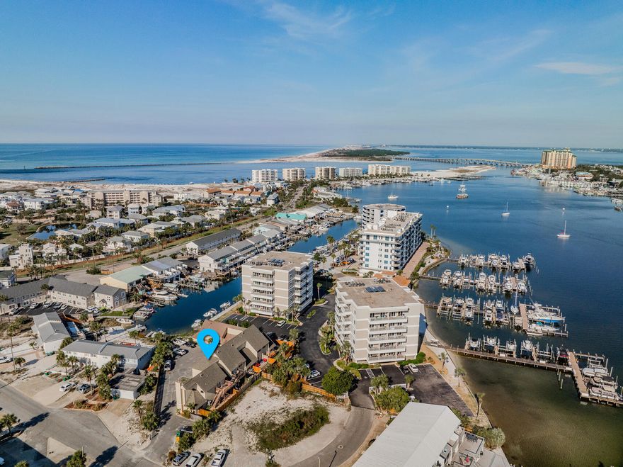 Beautifully updated townhome on HOLIDAY ISLE! This home offers 3 bedrooms, a bonus area, and 2 1/2 baths, a lower private deck and an upper deck with views of the Destin Harbor. Upgrades include granite countertops, stainless steel appliances, and not to mention a master suite oasis. Court Del Mar is located at the end of a canal while the Harbor and Crab Island is a boat ride away. Not to mention, the Destin water taxi will take you to the harbor to join the dining, dancing, and festivities that Destin has to offer!! Also, don't forget about the BEACH...Beach access is located at O'Steen Beach. Holiday Isle HOA fee is $285 a year. This home is offered FULLY FURNISHED perfect for an investment property or primary residence in the heart of Holiday Isle! Call today for a private showing!