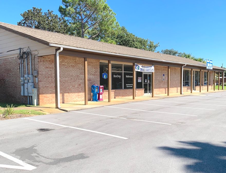 Highway Frontage Rental on high-traffic corridor west of Hurlburt Field.  One side of the duplex is currently rented, this listing is for the unit on the west end of the building with open parking and easy access from Highway 98 W.  Currently vacant, open retail space, storage and utility/office with restroom.  Double-wide side door for convenient load/unload access.  Tenant to verify all measurements.