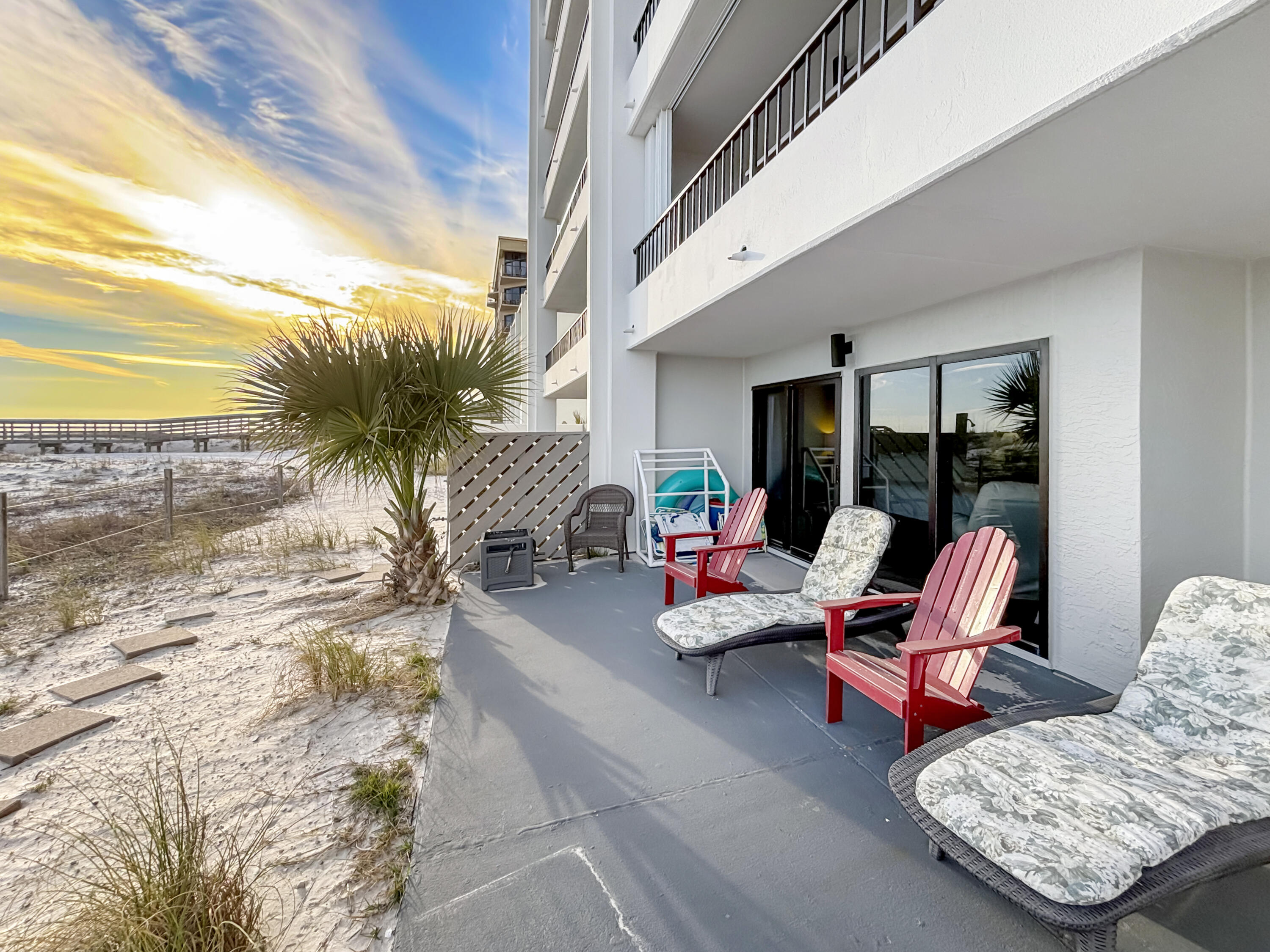 Welcome to Family Tides, a stunning beachfront condo located in the Surf Dweller complex on Okaloosa Island in Fort Walton Beach, Florida. This spacious 2-bedroom, 2-bathroom ground-floor unit offers 1,450 sq. ft. of coastal comfort with breathtaking Gulf views and direct beach access right from your private 450 sqft patio! Inside, you'll find a beautifully designed master bedroom featuring a king-size bed, en-suite bathroom, and private patio access, while the guest bedroom offers two queen-size beds for extra comfort. The open-concept living area provides ample space for relaxation, complete with a sleeper sofa and futon to accommodate additional guests. A fully equipped kitchen with modern appliances, a breakfast bar, and a dining space makes mealtime effortless. For added convenience, the unit also includes an in-unit washer and dryer, making it perfect for extended stays. Step outside to enjoy the resort-style amenities, including a large outdoor pool and kiddie pool, lighted tennis and pickleball courts, and a BBQ grilling and picnic area. The private boardwalk offers direct access to the beach, with seasonal complimentary beach service providing the ultimate convenience.
Located just minutes from Destin, the Gulfarium, the Boardwalk, and an array of local dining options, Family Tides is the ideal spot for both relaxation and adventure. Whether you're strolling along the pier, exploring local shops, or enjoying the sugar-white sands, this condo offers the perfect blend of comfort and convenience. Book your stay today and experience the best of Okaloosa Island!
