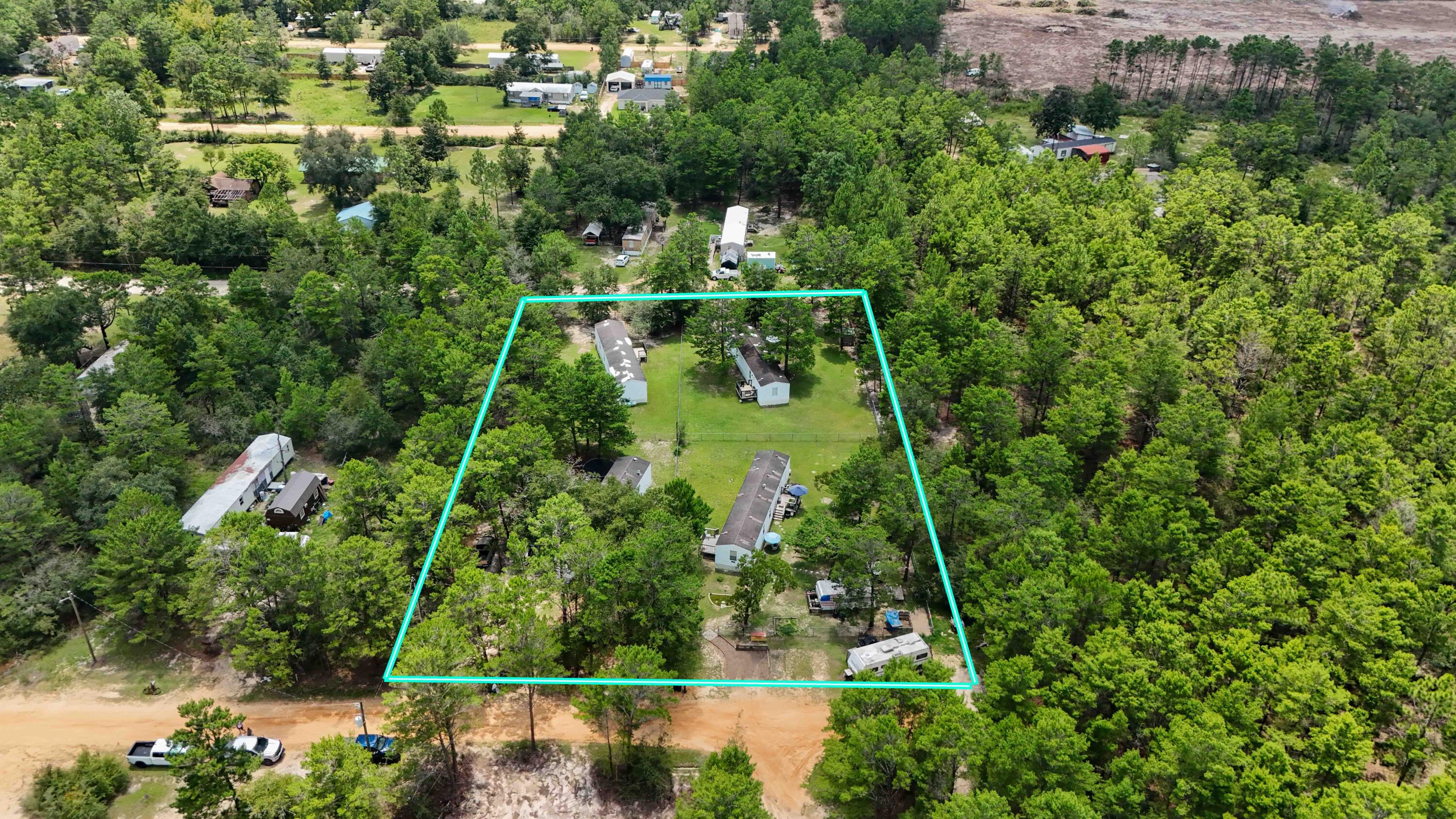 4 homes, with equal sized lots, on 1 parcel, all homes got a NEW METAL ROOF & a NEW COVERED PORCH in 2/2025!This nearly 1 acre parcel has four manufactured homes (each has it's own mailing address), all of which are 3 bedrooms, 1 bath, 924 sq ft, and built in 2005. Live in 1 and rent the other 3 homes...or rent all 4! (Survey available; rent on all 4 homes totals $3600/month). The first home (142 W Snapdragon St), has a brand new HVAC (5/2025) was recently remodeled and features new LVP flooring, fresh paint inside and on both outside decks, a new tub!The second home (156 W Snapdragon St), is the last home on a quiet, dead-end street and has been lovingly cared for and kept spotlessly clean by it's 8 year tenant! The third home (143 W Honeysuckle St), was remodeled in 2021 and has 3 year tenants.
The fourth home (155 W Honeysuckle St), has 14 year tenants!
This property is part of an available real estate portfolio. Properties in the portfolio can be purchased separately, with some, or all properties together! Seller negotiable on price if multiple/all properties in the portfolio are sold to the same buyer. Schedule your private showing today! All info in the MLS is intended to be accurate, but cannot be guaranteed.Buyer and buyer's agent to perform due diligence.
MLS #'s for the other properties in the portfolio that are listed for sale: 956805 and 956610.