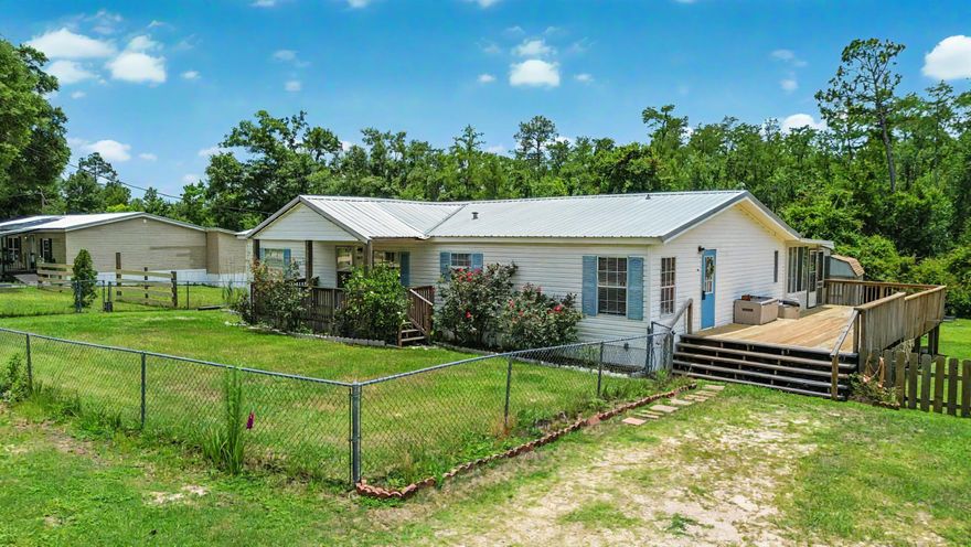 Discover the perfect blend of space, comfort, and potential at 8819 Kiwi Lane. Situated on a sprawling 1-acre lot, this 4-bedroom, 3-bathroom home offers an incredible amount of indoor and outdoor living space, making it ideal for large families or anyone seeking room to grow. This massive home boasts huge bedrooms, a spacious kitchen, and three full bathrooms, including one with a luxurious jetted jacuzzi tub. Step outside to enjoy the expansive outdoor features, including a screened-in back porch, a new side porch, and a welcoming front porch, perfect for relaxing or entertaining. The fully fenced backyard includes a detached shed for extra storage and even has a rooster! The property lines extend deep into the woods, offering plenty of room to expand or create your own private retreat. Whether you're envisioning a garden, workshop, or additional outdoor space, the possibilities are endless. Schedule your showing today to experience all that 8819 Kiwi Lane has to offer!