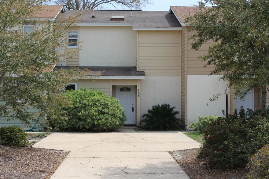 Renovated 2 bedroom/1.5 bath townhome with 1148 sq ft conveniently located in the heart of Destin FL and close to shopping and dining! This townhome has been renovated with granite countertops in the kitchen, professionally painted on the interior, new raised panel doors throughout, newer light fixtures, new sink and faucet in the kitchen, new carpet and base molding. There is a raised breakfast bar that seats 3 and an eat-in kitchen area. The kitchen has a built-in microwave and dishwasher. The kitchen opens to the living room and eat-in area. There is half bath on the first floor. The laundry room is located off the kitchen on the first floor. The entire first floor is ceramic tile. Upstairs there are two bedrooms.