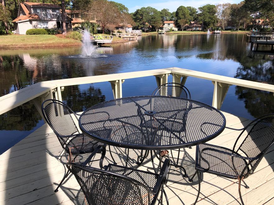 Perched lakefront, tucked away among the shady pines and giving an old Florida feel, sits Grace Cottage. An absolutely adorable coastal retreat, in pristine condition, and located in the popular neighborhood of The Fairways in the Resort of Sandestin. Grace Cottage is a spacious 3 bedroom, 3 bath, 1,606 sq. ft. home that has been lovingly cared for and recently updated. Selling fully furnished, turnkey ready, and even with the new golf cart and cover. The large deck overlooking the lake has just been added along with the outdoor storage shed. The new oversized brick paver parking pad can easily fit two full sized cars and the golf cart. The kitchen has been remodeled to include new, top of the line, stainless appliances, granite counter tops, shaker style white cabinets, sinks,