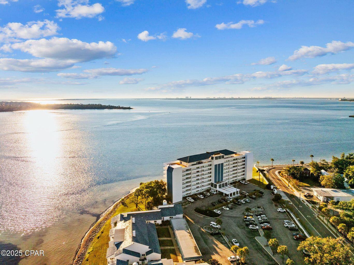 One of a kind find! Two units were combined to complete this 2,701 sq. ft. home. One of the largest units in the Cove Condominium, located directly on St. Andrews Bay and just a few blocks from the revitalized Historic Downtown Panama City, popular restaurants, and shopping. This unit has a master bedroom looking out over the bay with a private balcony and a family living area looking over the bay all in the same unit. All sliding glass doors have been updated and are protected by automated roll down storm shutters. Two storage units accompany the unit along with 2 parking spots right near the entrance to the elevators. Living in the complex, you get to enjoy a beautiful pool that overlooks the bay, a large Community Clubhouse, and a dock that can be used to tie up your boat or for fish fishing! This unit was just freshly painted and has a brand-new HVAC system. Call to schedule an appointment today!