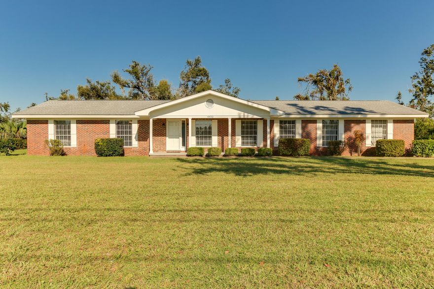 ***SEE THIS ONE TODAY. IT WILL SELL QUICKLY!!***Extraordinary curb appeal. Drive by today, then call your favorite Realtor to view. Well maintained home with large (1+ acre) lot and large beautiful oak trees. Big garage with workroom. New flooring and redecorated bathrooms. All new light fixtures. Minimal hurricane damage that is already repaired. Home has never been smoked in, owners were non-smokers. Room to build outbuildings for RV/Boat Storage.All measurements are not precise. Please measure if important to your decision to purchase.