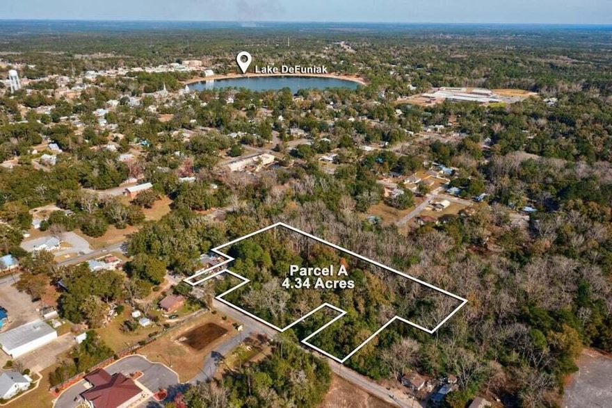 Prime Multi-Use Development Opportunity! Discover 5.03 acres of multi-use zoned land in the heart of DeFuniak Springs, offering flexibility for both residential and commercial development. Ideally located less than one mile from Walmart, Lake DeFuniak, and Interstate 10 (Exit 85), this property is perfectly positioned in a high-traffic, fast-growing area. Whether you're planning retail, office space, multi-family housing, or a mixed-use project, this lot provides endless potential. Utilities nearby with excellent road access. Buyer to verify specific land use and development requirements.