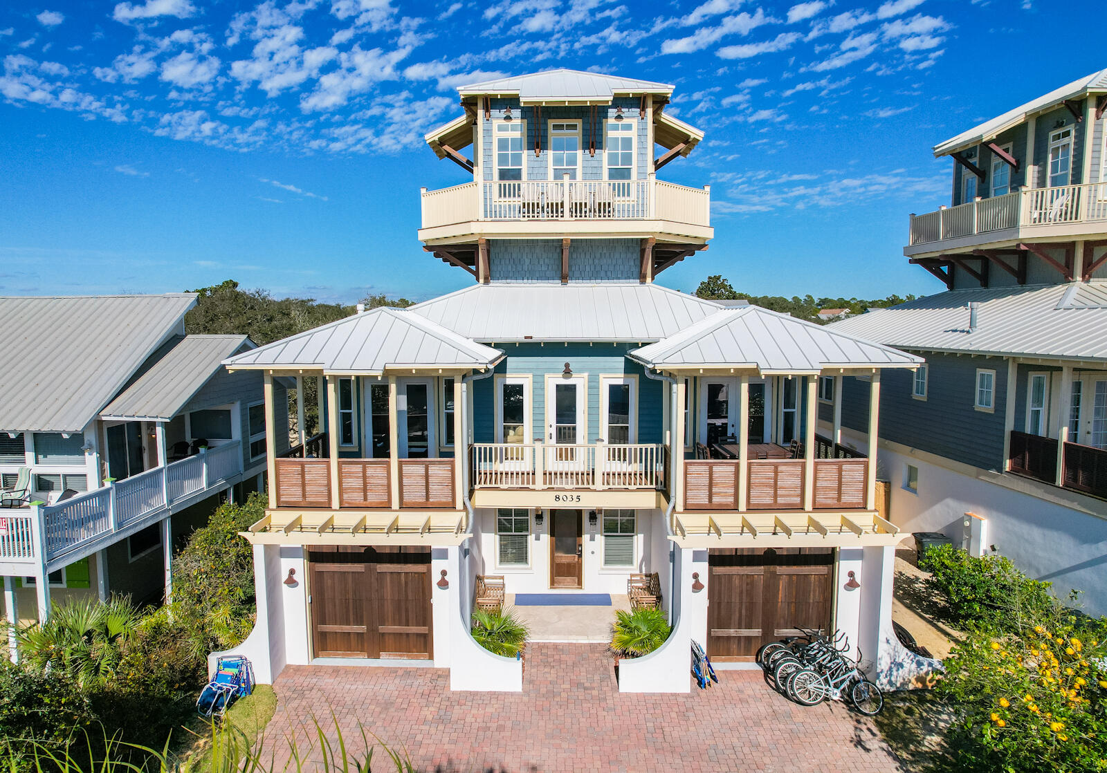 Gorgeous three-story home in Gulf Lakes Beach Estates. Located on the east end of 30A, this 4 bedroom home with bonus room sleeps 18 heads in beds and has a private pool. Amazingly, the Gulf Lakes public beach access is located directly across the street from the property. Views of the Gulf of Mexico are virtually unobstructed from third floor tower, featuring a bonus room with wraparound deck giving breathtaking 360 views. One of the two garage spaces was converted to an extra bedroom. New mini-split A/c systems were installed in both the converted garage and third floor bonus room for extra comfort. The first floor has three total bedrooms with extra living area. The main floor on second level has big, spacious living/dining area, perfect sized kitchen and an expansive front deck.