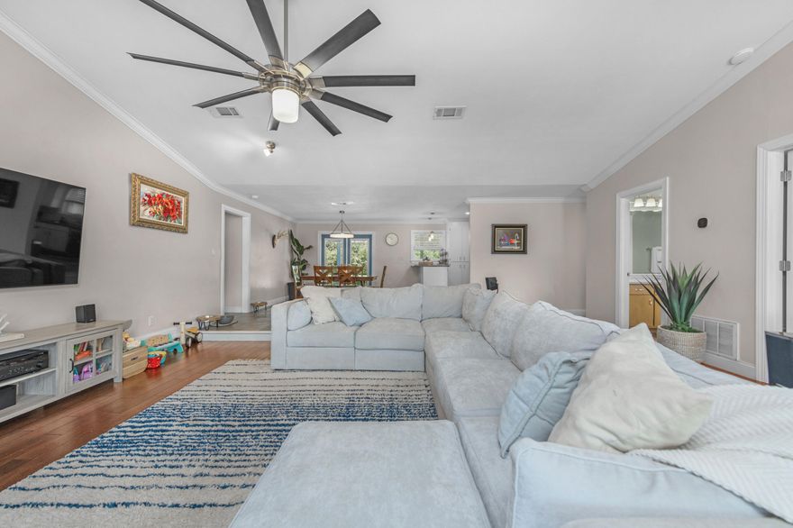 Set on nearly an acre and one of the highest elevation points in Navarre, this beautifully maintained property offers privacy, space, and versatility -- all less than 3 miles from the beach. The double lot backs up to county access, so there are no rear neighbors, and the peaceful backyard makes the most of its natural setting.Inside, you'll find 3 spacious bedrooms, 3 full bathrooms, and multiple living spaces including a renovated office and bar area (2023). A sunken living room with fireplace, a split bonus room with French doors, and a finished garage with A/C give you options for working, entertaining, or relaxing. The kitchen was updated in 2021 with new appliances, lighting, and backsplash, and major systems -- including the roof (2020), HVAC and ductwork (2024), water heater (2024), and electrical panel (2024)  have all been taken care of.

A separate garage + workshop with a two-post automotive lift is ideal for vehicle storage or hobbies. There's also ample space to park an RV, boat, or extra vehicles  with no HOA restrictions.

The surrounding neighborhood is known for its quiet atmosphere and welcoming neighbors who help create a strong sense of community.

Plan: Schedule a private tour and explore how this well-maintained property can fit your vision.

