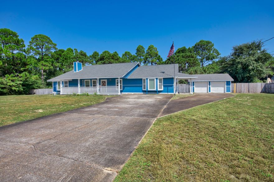 Set on nearly an acre and one of the highest elevation points in Navarre, this beautifully maintained property offers privacy, space, and versatility -- all less than 3 miles from the beach. The double lot backs up to county access, so there are no rear neighbors, and the peaceful backyard makes the most of its natural setting.Inside, you'll find 3 spacious bedrooms, 3 full bathrooms, and multiple living spaces including a renovated office and bar area (2023). A sunken living room with fireplace, a split bonus room with French doors, and a finished garage with A/C give you options for working, entertaining, or relaxing. The kitchen was updated in 2021 with new appliances, lighting, and backsplash, and major systems -- including the roof (2020), HVAC and ductwork (2024), water heater (2024), and electrical panel (2024)  have all been taken care of.

A separate garage + workshop with a two-post automotive lift is ideal for vehicle storage or hobbies. There's also ample space to park an RV, boat, or extra vehicles  with no HOA restrictions.

The surrounding neighborhood is known for its quiet atmosphere and welcoming neighbors who help create a strong sense of community.

Plan: Schedule a private tour and explore how this well-maintained property can fit your vision.

