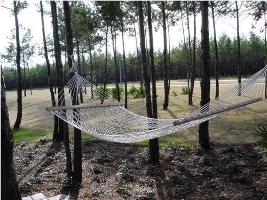 Short sale. Nice deep pie-shaped lot. Own your lot and build your future home in one of the Emerald Coast's most exciting premier communities. You'll be surrounded by the beauty of nature, with thoughtfully planned walking trails, bike paths, and bayside Clubhouse on the beach. Crammed with amenities, there are also ballparks, tennis courts, fitness center, amphitheater, community park, pool, playground, basketball, meeting facility. You may choose to have your custom home built on this lot by Felix Beukenkamp Builder, or choose from one of his existing plans. Short Sale will be approved quickly, as this is a local lender.