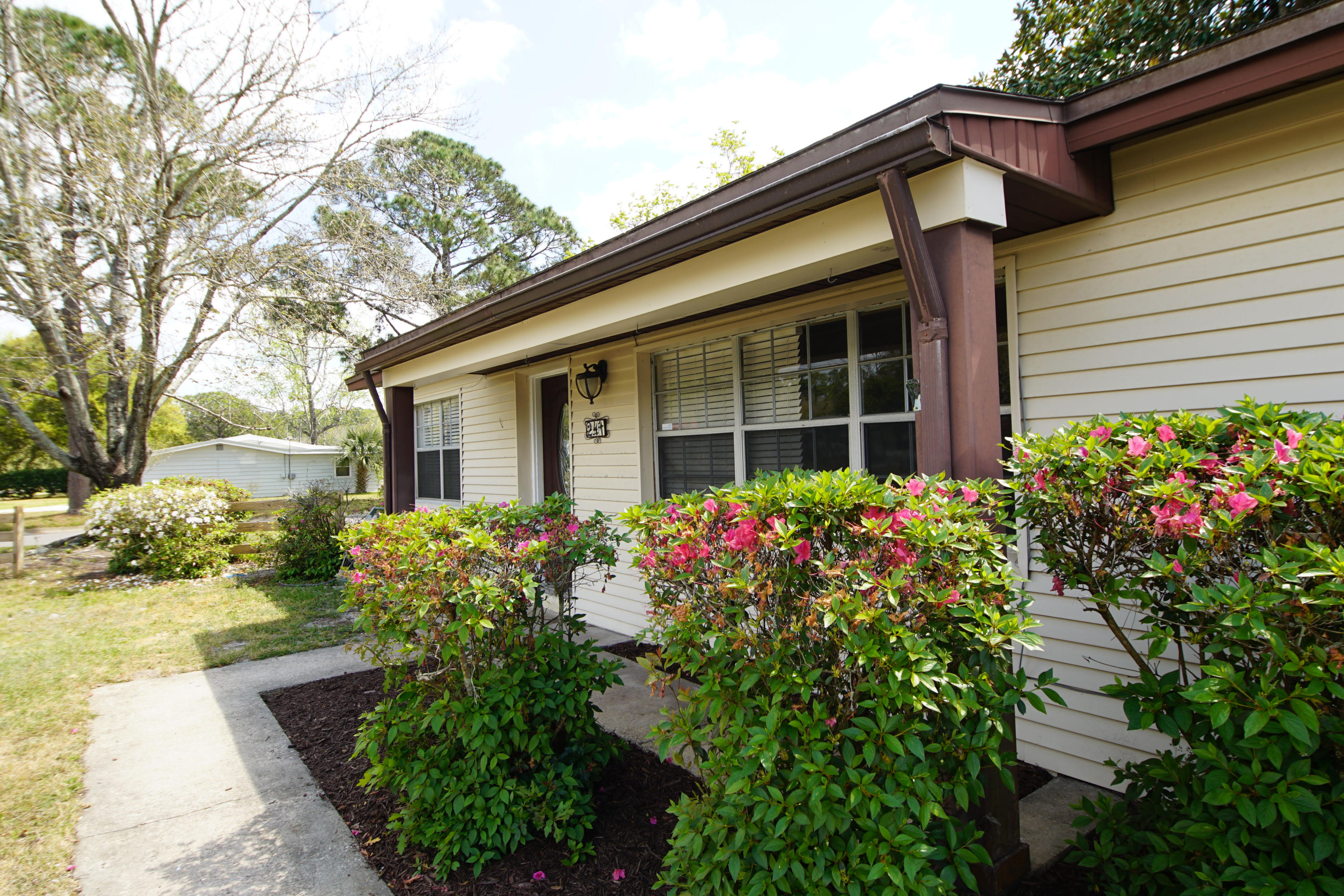 Don't miss this! New Roof completed March 2019! This charming home sits conveniently east of base. It boasts an open floor plan with 3 bedrooms and a flex space which is receiving new paint and super sturdy bamboo flooring prior to listing, making it a perfect man cave, craft room, workout room, teenager space- the options are endless! Seller has paid attention to the details, with wood flooring, updated carpet, and offering home warranty. This home sits on a corner lot in a quiet neighborhood. Stroll down the sidewalk to the neighborhood playground. Easy neighborhood access- able to turn left out of neighborhood- no u-turn required! This home is ready for its new owners- Don't Miss Out.