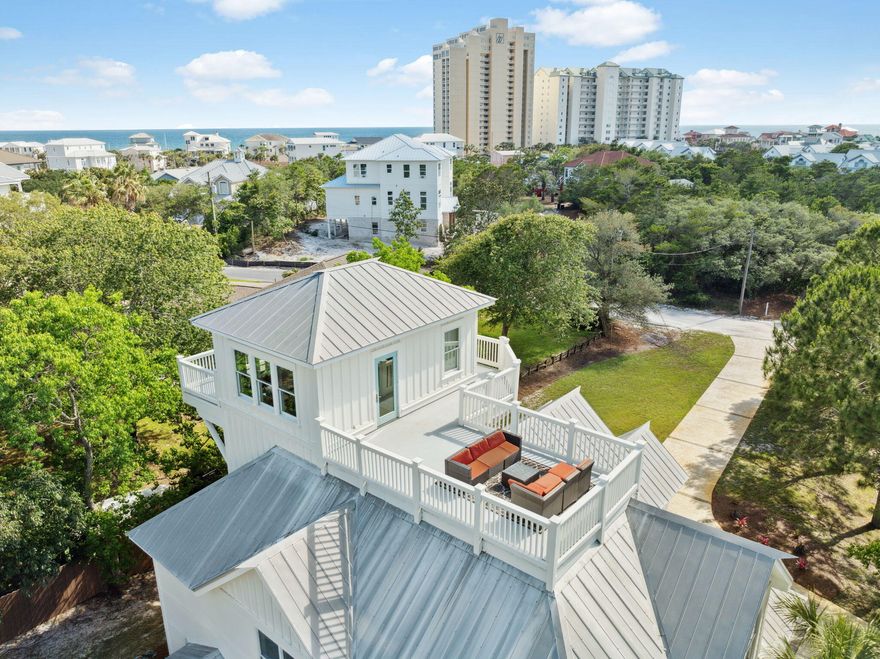 Tucked away in Miramar Beach, Gulf Pines is one of Walton County's best-kept secrets--a coveted, low-density neighborhood where all homesites are a minimum of 1/2 acre, offering an unparalleled blend of privacy, natural beauty, and convenience. With over 1,400 feet of private, deeded beach access just a short walk from your doorstep, this serene coastal enclave offers a truly relaxed, uncrowded beach experience, ideal for a primary owner or lucrative vacation rental. Set on over half an acre and surrounded by mature, lush grounds, this beautiful five-bedroom retreat complete with a private pool with sun shelf perfectly captures the charm and comfort of life on the Emerald Coast. Inside, the open-concept layout offers a spacious living area that flows seamlessly into the dining space and a beautifully appointed kitchen with custom cabinetry, marble countertops, stainless steel appliances, and a generous island bar. A mudroom and guest bedroom on the first level provide added functionality and flexibility. The home has received several recent upgrades including a fresh interior paint and a newly refinished pool deck with paverscreating an ideal setting for outdoor entertaining or peaceful afternoons in the sun.

The second level features duel primary suites, both with private balcony access. The main primary bedroom boasts a luxurious ensuite bath with duel vanities, walk-in shower and jacuzzi tub. Also located on the second level is a fun, coastal-inspired bunk roomperfect for younger guests or extra sleeping space.

Ascend to the third level to discover a loft-style bonus room complete with a wet bar and ice makeran ideal setup for entertaining, relaxing, or even working remotely. This versatile space could serve as a media room, game room, or a quiet home office retreat.

Just beyond, the shipwatch offers a peaceful perch with southwestern exposure, where you can enjoy glimpses of the Gulf over a mature canopy of pine trees and take in vibrant sunset vistas from the spacious sundeckperfect for unwinding, sunbathing, or hosting golden-hour gatherings.

In addition to the nearby beach access, this home enjoys a prime central locationjust a one-minute drive to the area's top shopping and dining destinations. Explore over 110 designer and brand-name factory stores at Silver Sands Premium Outlets or enjoy the upscale retail, restaurants, and events at Grand Boulevard. You'll also be just moments from the vibrant atmosphere of Baytowne Wharf in Sandestin, known for its family-friendly entertainment, waterfront dining, and nightlife.

This is a rare opportunity to enjoy the best of coastal livingquiet, private, and naturally beautiful, yet only minutes from everything you love about South Walton.