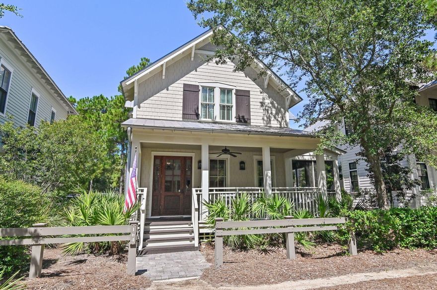 This beautifully designed four-bedroom, four-and-a-half bath coastal retreat is perfectly situated just steps from Camp WaterColor, offering an exceptional blend of style, comfort, and location. From the shingled exterior and gracious front porch to the tranquil blue and white interiors, every detail is thoughtfully curated for relaxed yet refined beach living. An inviting natural wood front door opens to an airy, open-concept layout where casually elegant living and dining spaces flow seamlessly. The chef's kitchen is a highlight, featuring professional-grade stainless steel appliances, gleaming quartz countertops, a spacious island, and warm, wrought-iron pendant lighting. Designer finishes, transitional furnishings, and coastal accents set an atmosphere of understated sophistication. Ideal for family gatherings, the home offers generous seating indoors and out, including a large screened side porch perfect for alfresco dining. Two master suites  one on each floor  provide privacy and flexibility, with the upstairs suite featuring a sitting area and window seats. All baths are modern and beautifully appointed, featuring luxurious details such as a large soaking tub and a walk-in shower in the primary suite. Exceptional craftsmanship is evident throughout, from crown molding and coffered ceilings to hardwood floors, wainscoting, and custom window treatments. A fully equipped laundry room, Navien tankless water heater, multiple smart televisions and low-maintenance landscaping add convenience, while paver parking and an architecturally matched storage shed enhance the property's practicality. With access to WaterColor's unrivaled amenities  swimming pools, tennis and pickleball courts, beachside dining and more  this elegant home is the perfect sanctuary for families and friends seeking the quintessential coastal lifestyle.

