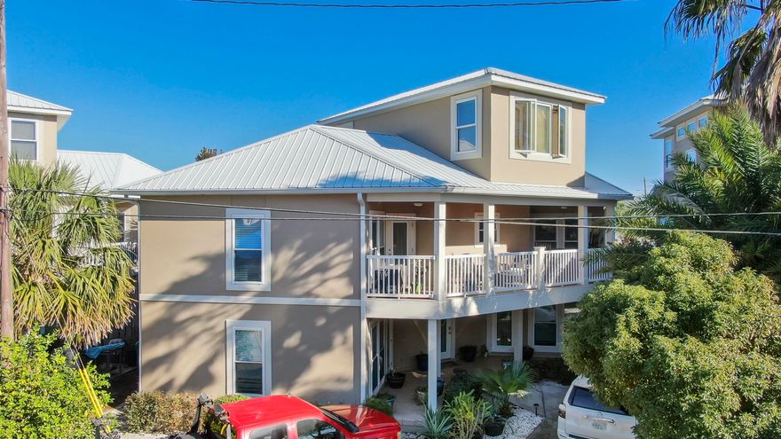 This gorgeous 3 bedroom, 3 bath, 3 STORY BEACH HOME is  just steps to the sand.. public beach access #89 --The location is also just MINUTES TO THE SHOPS AND RESTAURANTS OF 30A! The first floor of the home has a split bedroom floor plan with private en suite bathrooms and PRIVATE ENTRANCES for each bedroom! Both first floor bedrooms are VERY spacious with lots of natural light, walk in closets and doors separating the rooms from the center foyer leading to the second floor. You would have the option of using the home as a primary residence, a vacation home, or a rental or ALL THREE if you wanted to generate rental revenue while occupying the 2nd & 3rd floors of this home! The kitchen on the second floor showcases stainless appliances, granite tops, and plenty of cabinet space. The large living/dining room has plenty of space for entertaining! Fully furnished with tasteful decorations, this home is MOVE IN READY! The large covered balcony has entry doors off the living/dining room and the master bedroom. This oversized balcony is a wonderful place to sit back, relax and enjoy the Gulf breeze! The master bedroom is VERY spacious with lots of natural light, a walk in closet, a beautiful master bath and a door leading out to the balcony. Going up to the third floor there is a fantastic bonus room with beautiful VIEWS OF THE SHIMMERING EMERALD BEACHES! This room would make a great sitting/reading room, family den, gym, or another bedroom! The home has LOTS OF UPGRADES....The HVAC systems are new. It has a Renai gas instant hot water system. The balcony railing was recently upgraded to vinyl, balcony ceiling upgraded to knotty pine, the kitchen flooring upgraded to ceramic plank, hardwood flooring installed in the living/dining room and on the stairs. The exterior of the home was recently repainted and extra pavers added for additional parking out front. This home is also equipped with an Enco SECURITY SYSTEM, and the lawn and gardens irrigated with Rain Bird sprinkler system. There is a 10X12 shed on concrete pad for storage. Come view this property today!