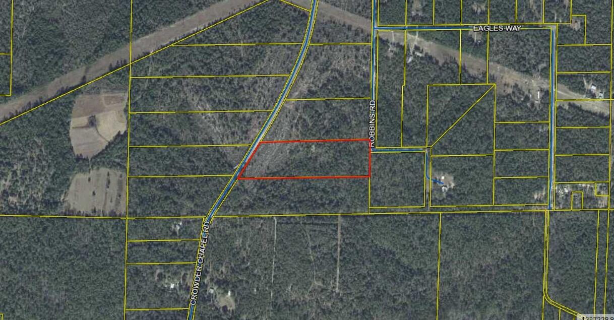 Beautifully treed lot on 12 acres, great place to build your dream home. The Sellers have power and water run to the street. There is also a cleared area on the property.
