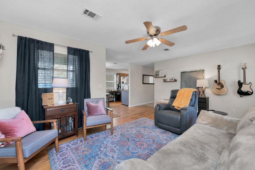 Charming Florida cottage ready for you to call home! Original hardwood floors in pristine condition throughout the home. Updated kitchen to include cabinets, countertops and stainless steel appliances in 2014.  Split bedroom floor plan with a large master bedroom with sliding glass doors leading out to the new deck. Spacious master bath also includes the laundry. NEW HVAC 2019, NEW SEPTIC 2020. 1200 sf Workshop prepped for electrical, expansive fully fenced level lot with room for anything your heart desires. Chickens, play space, RV or boat parking. You have to see this one to appreciate all the character and detail.