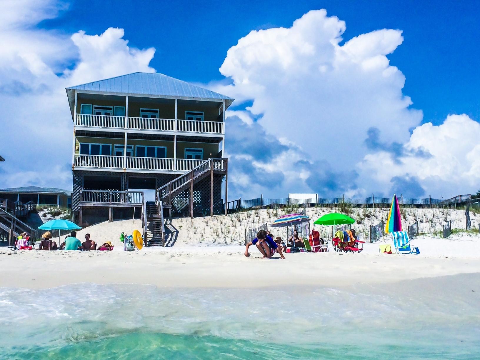 THIS IS THE BEST PRICED GULF FRONT HOME on Scenic Hwy. 30A! 50' of pure beachfront privacy. Superior LOCATION! This is the perfect family GULF FRONT BEACH HOME in popular quiet W side of Santa Rosa Beach and excellent rental property-grossed $71,631.45 in 2012; $88,946 in 2013. New roof installed in April 2013-New hurricane straps 2014. Newly remodeled Kitchen/MBath 2015-New gulfside deck 2013. Very comfortable, charming Florida-style cottage home atop premier awesome gulf-front dune location that provides lake views in a historic coastal village. Enjoy private, easy beach access with a private walkover that has patio/observation deck with an outdoor shower. Outdoor shower also located on 1st floor. Lots of natural warm Florida sunlight flows in from the many south-facing LR/DR