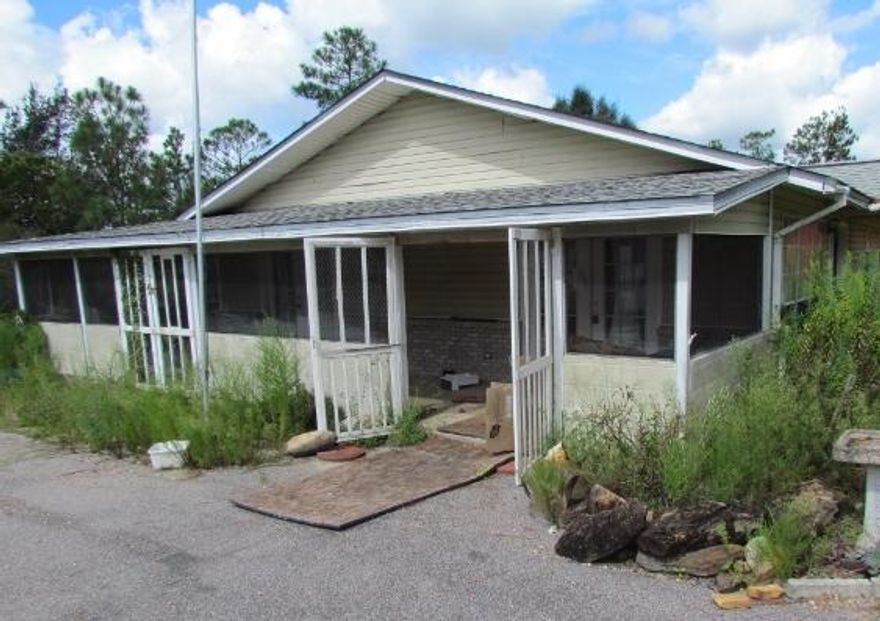 Ranch style 3 bedroom, 3 bath home on 2.45 Acres. There is a lot of elbow room on this parcel that is set in a private setting. There is a wrap around porch on the side and back of the house so that you can view your property! The kitchen is large and has a lot of counter space and cabinets. The living room is very large with upgraded flooring. This house will require work to be done. It is being sold 'as is'. Buyer to verify all pertinent information to satisfy themselves.