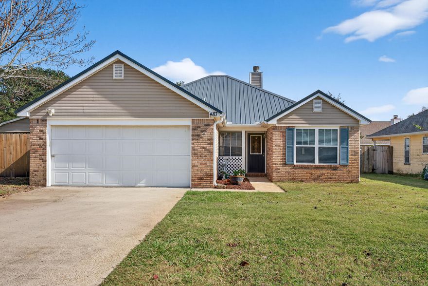 Beautifully updated 3BR/2BA, 1,298 sq ft home on a large corner lot! Features include a 2023 metal roof, fresh interior paint, LVP throughout, stainless steel appliances with a brand-new fridge, new LED lighting, fans, and blinds in every room. Enclosed patio,Enjoy a newer full privacy-fenced yard with multiple large access gates--perfect for parking boats or trailers. Property includes a powered workshop/shed with attached carport, plus a 2-car garage with heated/cooled mini-split. Full sprinkler system with well pump. A/C replaced in 2021; water heater 2016. Convenient to the base, schools, and shopping.