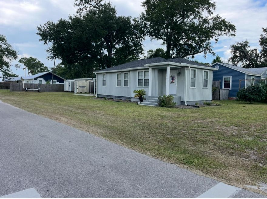 Spacious Port St Joe corner lot home with room for a boat or RV. 3 bedrooms 1 bath with a newer roof and central AC. Turn key ready and sold AS IS. New plumbing, termite bond, outdoor shower, seamless gutters, storage building, 2 car carport, and privacy fence. WIFI thermostat. Simpli Safe security system. No HOA!