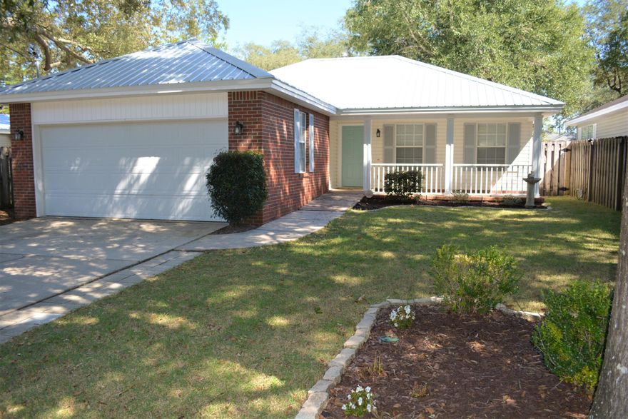 Fantastic Location !  Remodeled! New Metal Roof. New Pergo Floors, New Granite, New Stove & microwave, new vanities, lights, new faucets.  Touch Less Kitchen Faucet.  A Zero Entry Master Bathroom Shower!  Walk in Closets in every bedroom.  Fenced in yard and 10x10 shed.  Everything about this house is wonderful.  Conveniently located and so easy to pop here and there in Niceville. Video camera locations:-NE corner (MBR)-NW corner (Garage)-SW corner (porch)-Front porchCameras not included.Cat5e Ethernet cables to bedroom 2Two cables to the LR entertainment wall/area are for playstation/xbox/video-games,TV, etc.