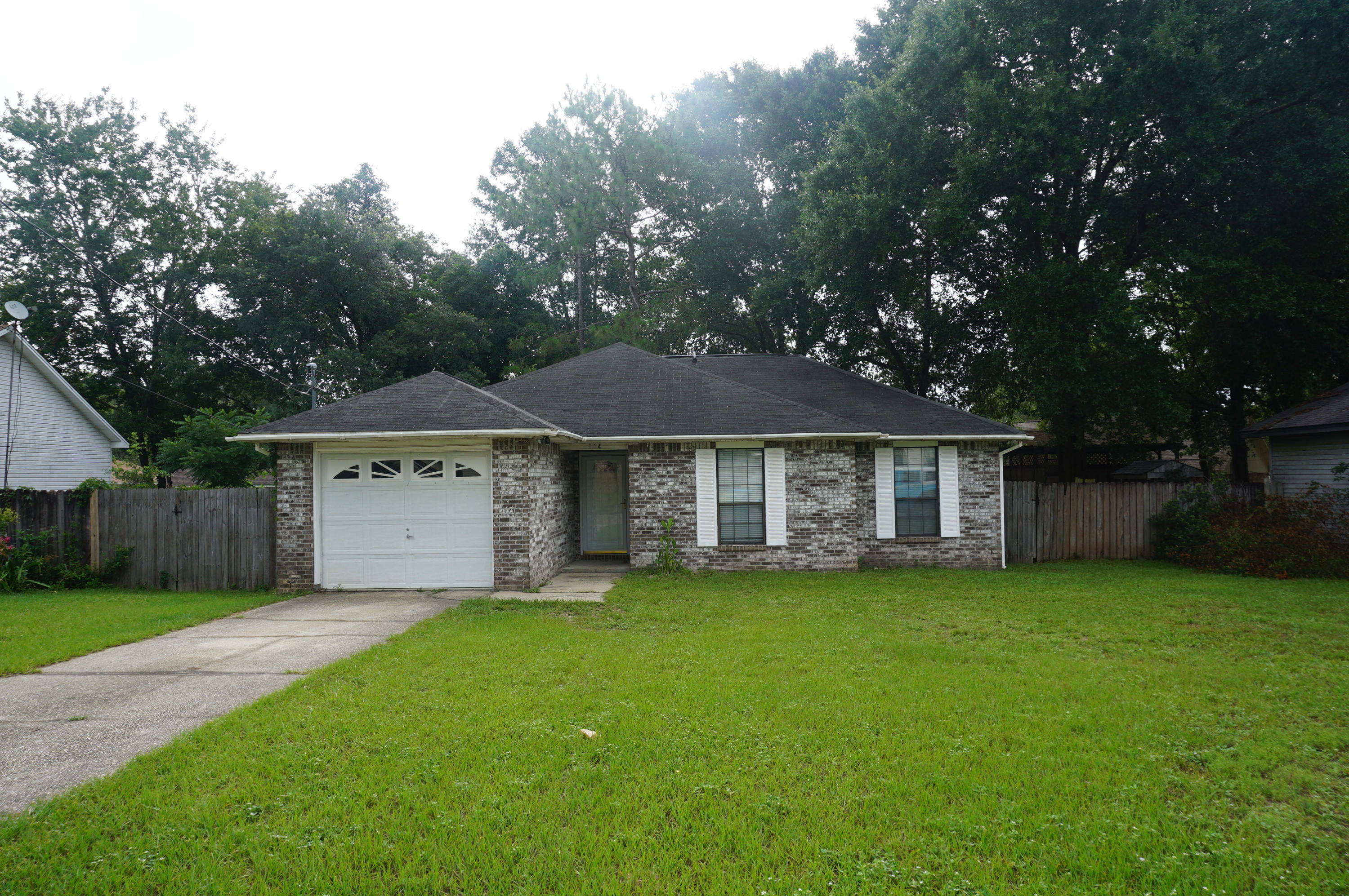 Available 01/06/2025....Cute 3/2 South Crestview home with easy access to all bases, beaches and shopping. Ceramic tile flooring, black appliance package, 1 car garage, open back patio, privacy fenced back yard and spacious living area with vaulted ceilings. No inside smoking. Pets will be allowed with a $400 non-refundable pet fee and owner approval. Large open back deck.  Lawn care provided in rental rate.