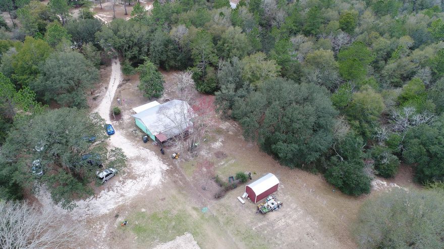 Coastal cottage on nearly 5 acres. This home was gutted from the studs out; boasting new sheetrock, new windows, new flooring, new light fixtures and ceiling fans, new kitchen cabinets, new countertops, new backsplash, and the bathroom was completely renovated (ALL NEW)! There's a 2-stall barn for your animals, a storage shed for your ''toys'', and an outdoor kitchen/studio apartment for guests. Did I mention fruit trees, RV hookups, county taxes, and a transferable termite bond. The property is completely fenced, and some of the fencing is electric. What are you waiting for? Make your appointment today.