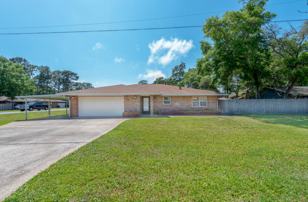 Great corner lot home in a very popular community. Lots of natural light accented with can lights, skylights and lighted ceiling fans. Expansive, open kitchen/dining/living area with french doors leading to open patio and fenced back yard. Ceramic tile throughout. Large two car garage with extra work shop. Additional attached and covered carport with room for additional vehicles or toys. CCTV covers various external views and can be seen on monitor in master bedroom.PASA Soccer Field just a short two block walk away. Minutes from Eglin AFB and a short drive to Okaloosa Island and Destin Harborwalk.This home is move-in ready. You may also choose to get a home renovation loan and ''make it your own'' with your specially designed upgrades.