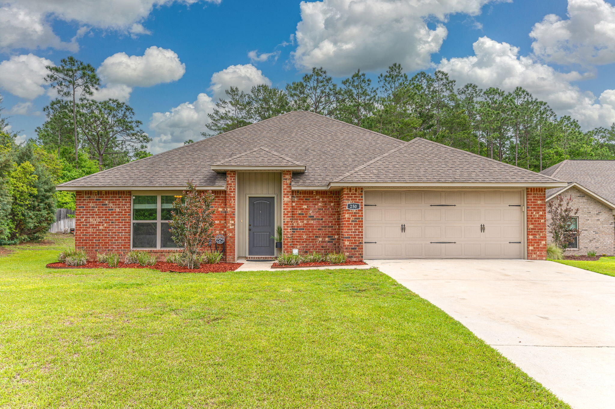 Extraordinary Find in South Crestview. Camille Cove S/D complete with Underground Utilities/Street Lights/Mail Manager. This Low Maintenance Brick Home Features 3 bd/2 ba PLUS Bonus Room. Upon Entering you will Immediately be Greeted by an Open Floor Plan/Elevated Ceiling/Luxury Vinyl Flooring. The Kitchen Overlooks the Main Living Area/Breakfast Nook & Exits Through the Garage for Easy Grocery Drop Off. Features include Modern Cabinets, Beautiful Granite Counter-Tops, Large Pantry & Stainless Appliances. Primary Suite is located Across the Home from the Additional Bedrooms for Complete Privacy. The Master Bathroom has Dual Granite Vanity, a Walk-In Closet and Private Water Closet. The Backyard has a Privately Fenced/High Efficiency Heat Pump and Upgraded Maniblock Plumbing System..