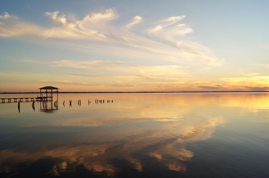 Taking back up offers. If you're looking for a waterfront fixer upper this is the home for you. Nestled directly on the Choctawhatchee Bay in Freeport minutes away from the 331 Bridge, beautiful lot with mature hardwood trees, amazing sunsets and bay views! Top Floor is a rustic 3br/2ba, 1620 ft with galley kitchen, living room, dining area, porch and large deck. Unfinished bottom floor is not included in the sq ft area includes, washer and dryer hook up, a full bath and can be used for storage or workshop. The little house is a hybrid home with wood siding and is not included in the sq ft it is 1br/1ba, kitchen, living and dining area. Property is being sold AS IS buyer to verify sq ft. Late 2014 the interior of the main and little house was painted and some wood replaced. AS I