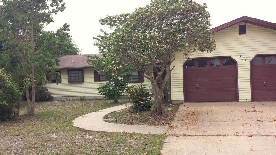 Under $225,000 - One story, 3 bedroom, 2 bath house in the heart of Destin. This home features large rooms including a spacious kitchen and dining area, plenty of STORAGE & parking. living room has a gas fireplace with pocket doors to separate it from the Family Room which is bright with natural light, has FRENCH DOOR access to the backyard party deck and two huge storage closets. The kitchen has Corian counter tops, a pass through to the family room, a gas range and plenty of cabinets for storage. The laundry room is located in the insulated garage. The two car garage is divided into two work spaces with a 1/2 bath and access to the side yard outdoor shower. The spacious Master Bedroom opens up to a lovely outdoor sitting deck. The two additional bedrooms and bathroom are good-sized also. Located in the popular Kell-Aire Gardens, this home is also near shopping, entertainment, the beaches, public boat ramp, and more. Kell-Aire Gardens has two city owned parks that are great for outdoor play for all. Being sold in ''As Is'' condition. This house won't last long! Buyer to verify all dimensions. Being sold AS IS and seller will pay up to $2,500 in the buyer's closing costs.