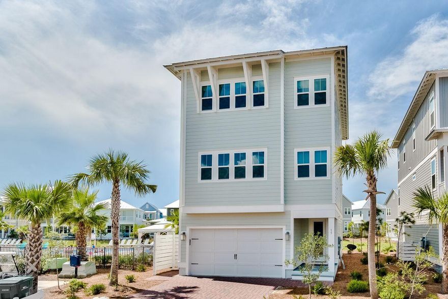 Put yourself in the middle of the action in this three-story home with gulf views next to the Prominence South pool and a short distance of The Hub. Featuring four beds, three-and-a-half baths and 3,550 square feet of living space, this home boasts a two-car garage at the end of a brick paver driveway and a private elevator that opens to all three floors for easy accessibility. The first floor is home to a suite that functions as either a bedroom or second living room with access to one of three outdoor living areas. The second floor is the hub for daily living with a great room, chef's kitchen, laundry room and more balcony space. The third floor features an owner's suite and two additional guest bedrooms. Notable features throughout include a sizable bunk room to boost sleeping