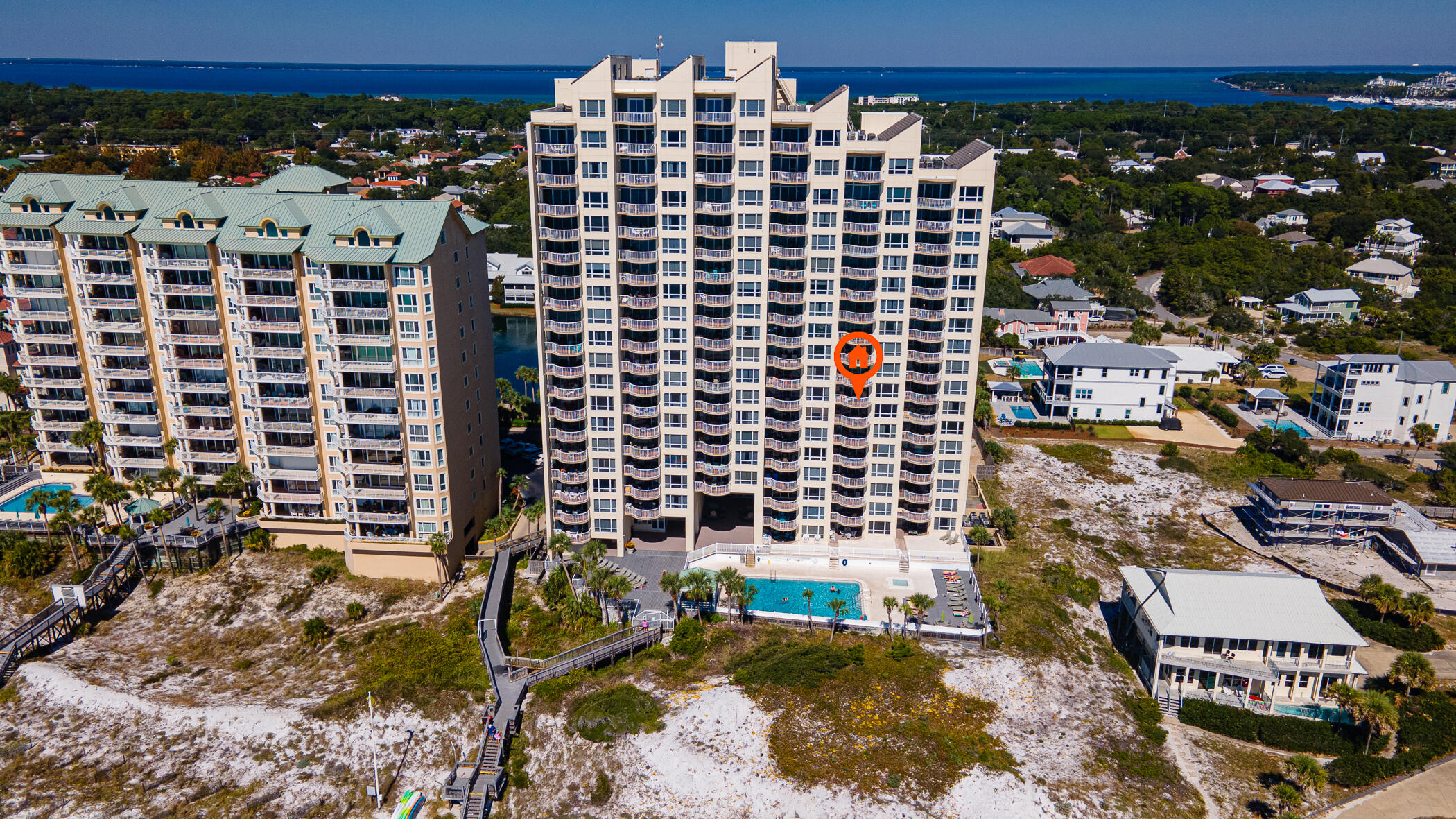Wake up every morning to a view of the emerald green waters and the turquoise sky. Or sip some bubbly as the sun sets over your 8th floor waterfront balcony. This condo is located on a pearly stretch of beach with green space, a shimmering lake, and excellent security. Amenities abound:  new pickleball courts, tennis, 3 pools (2 heated), a fitness center, playground, outdoor grills, cornhole.This delightful unit has never been a short term rental but lovingly cared for by the owners.Rental projections are $55-$65K. The entire unit was painted in '21. New dishwasher, washer and dryer added in '23. Kitchen cabinets were redone along with new lighting in the kitchen and dining area. Ceiling fans were added. Attractive and practical quartz kitchen countertops and tile backsplash were added