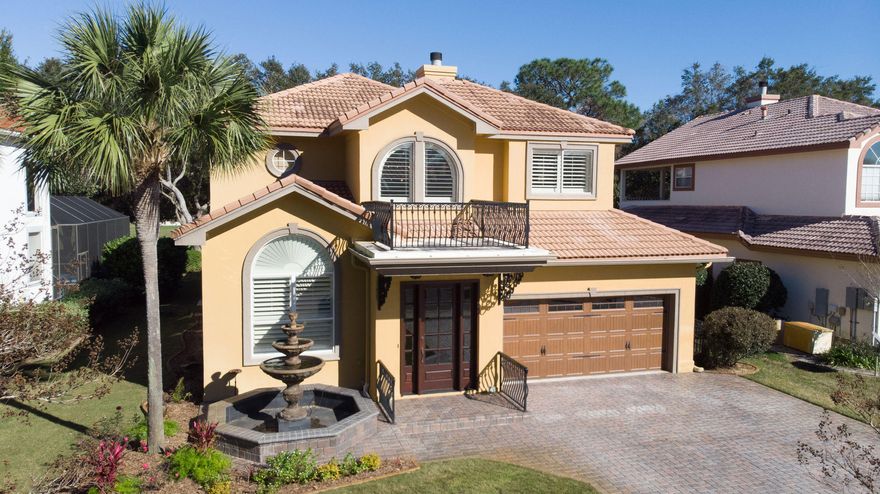 Located on the signature 15th hole of the Bob Cupp Designed Emerald Bay Golf Course, this contemporary home is beautifully landscaped including a garden fountain, palm trees, and live oaks. Through the solid mahogany front door with beveled glass, your eye moves past the richly appointed home office into the main living room with 20 FT ceiling overlooking the the sparkling pool with jacuzzi waterfall feature. Stunning architecture and fixtures adorn the the interior of this well appointed home. The kitchen is fully custom crafted with stunning granite counters and solid hardwood cabinetry, crafted in Canada, adorned with stacked crown molding, carved accents, doors, and trim in solid walnut. Equipped with the finest appliances for the most discerning chef in mind, enjoy preparing your favorite dishes using the 48 inch Dual Fuel Thermador Pro Series range with 6 burners, griddle, and grill, and double oven. Also, a Built-In Sub Zero Stainless Steel Refrigerator. Select fine wines from the  SubZero, full height, adjustable temp wine cooler, and let the stainless steel Bosch super-silent 39db dishwasher handle all of the clean up. A hammered, copper farm sink with Grohe faucets features a reverse osmosis water filtration system for healthy, clear, clean water. Guests can even experience the "Teatro Cucina", theater kitchen, at the granite counter window seating. The dining area overlooks the pool patio. Remote controlled shades on the picture window and sliding glass doors create any lighting effect you wish in the main salon. This immaculate home, with an open floor plan, has a view of the Choctawhatchee Bay from the pool patio and master bedroom which has separate outdoor access. The master bath features travertine floors and glass tile in refreshing pastel colors. The open shower boasts Grohe faucets and fixtures with Swarovski crystal knobs, rainshower and hand wand create a stunning shower experience. A separate garden tub is close by for long soaks. Moving up to the second level quarters features beautiful mahogany treads, handrails and gooseneck railings which overlook the main living room. Two bedrooms and a guest bath give comfort and privacy to guests and family alike. Enjoy relaxing evenings on the newly expanded screened patio while watching the shimmering waters of the newly resurfaced 30' X 11" pool and jacuzzi.  Gaze over the 15th fairway to lush green grass and natural surroundings. Quiet community living in Emerald Bay features a large community swimming pool, tennis courts and guest house. This guest house is the perfect answer to lodging when you need to keep your friends and family nearby. It contains 8 rooms with 16 beds, discounted golf rates, and the use of the pool and tennis courts. Centrally located between Destin and Sandestin, this home is a must see.