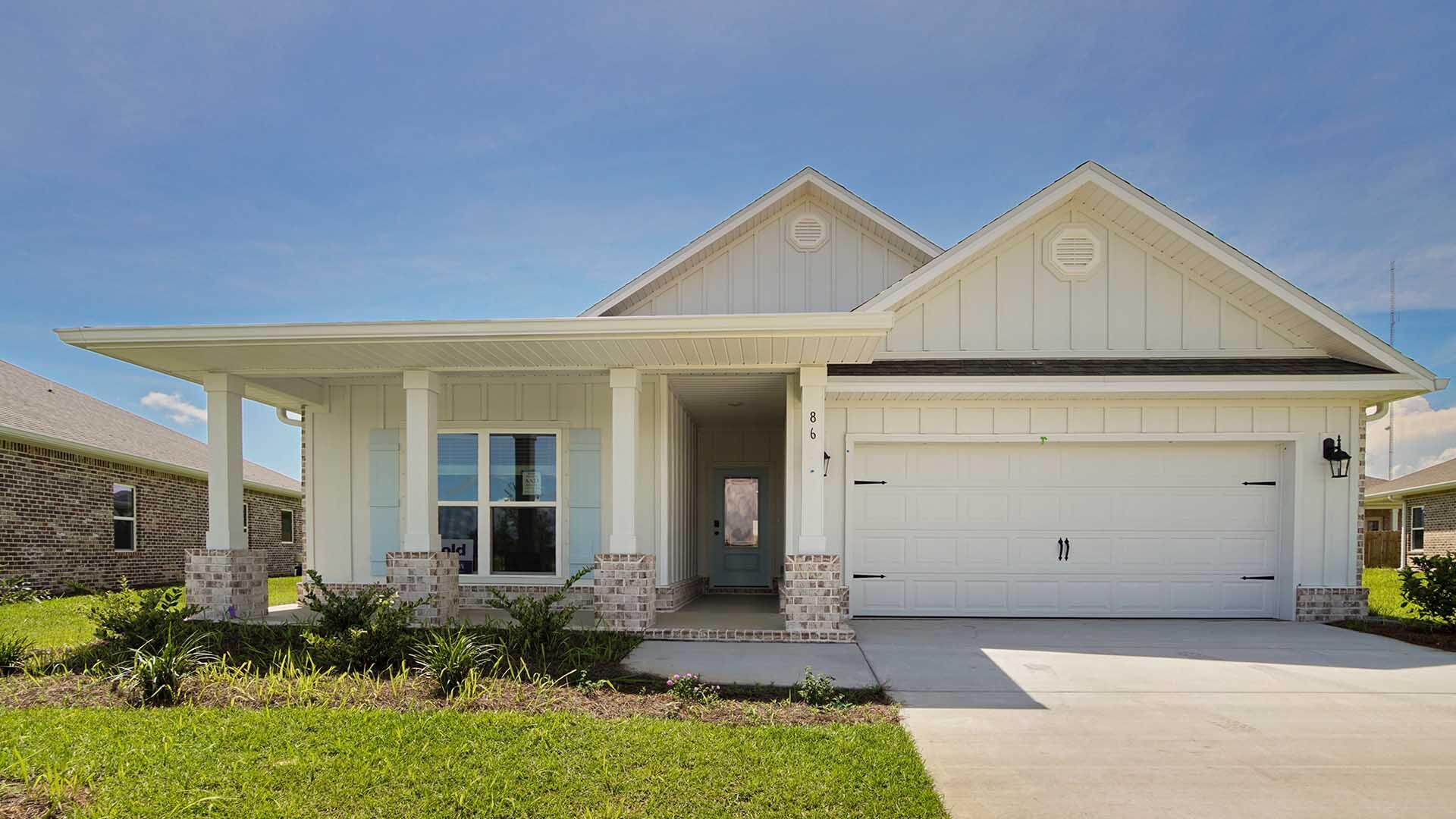 Welcome to 86 Grass Owl Loop, a new home at Owl's Head Farms in Freeport, Florida. This home has a large covered front porch and features four bedrooms and two bathrooms. As you enter this home, you will find a hall leading to a light-filled, open-concept living area with 9' ceilings. The kitchen is equipped with brand name stainless steel appliances and has been finished with elegant quartz countertops and beautiful white cabinetry with tile backsplash. The center island has an undermount single basin sink and a dedicated water filter faucet and dishwasher as well as space for bar seating. Adjacent to the kitchen is the dining area while the living room's wide layout invites comfort and relaxation. Matte black finish hardware on doors and faucets in kitchen and bathrooms. The primary bedroom offers a serene escape with a luxurious bathroom featuring a double vanity, a walk-in shower, and two generously sized walk-in closets. Three additional bedrooms and a full bathroom are in a separate wing, ensuring privacy for family or guests. EVP flooring is Plank flooring throughout the home offering a seamless transition between rooms. The laundry room is located off the hall leading to the fourth bedroom and has space for a full-size washer and dryer.
The exterior of this home includes an oversized covered patio and two car garage with remote entry. All DR Horton homes have Smart technology including 5 DEAKO?? Smart Switches, Kwikset keyless entry and a programmable thermostat that can be controlled though an app on your phone. Contact us today to schedule your tour of this beautiful home.