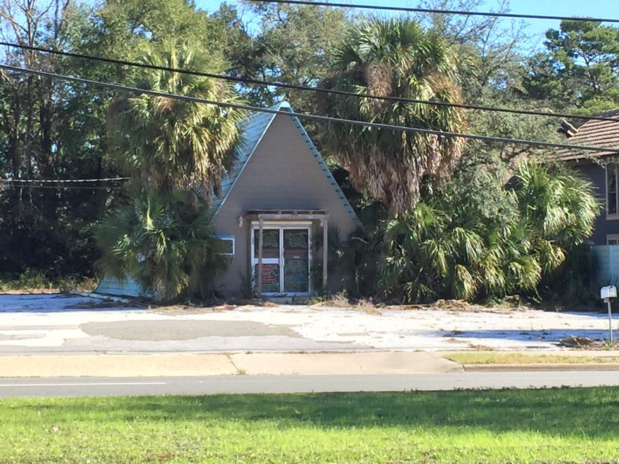 No value given to the building. Very visible location just off the corner of Mary Esther Blvd. and Hollywood Blvd.
