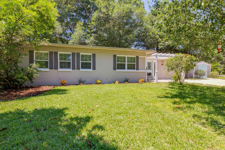 Renovated concrete block home exudes coastal charm in the sought after Elliott Point neighborhood. This 3/3 home was finished with white shaker cabinets, tile or driftwood colored floors throughout, light walls & aqua accents. TWO Spacious master bedrooms & en suite bathrooms which is unusual for this neighborhood. Large open kitchen with brand new white shaker cabinets, granite countertops and new S.S. appliances. Two living areas and there is even an indoor laundry room! New Energy Efficient windows & doors too! Situated on a corner lot with mature trees & a nice shaded deck in the backyard. There is even a nice large shed for storage! Just 10 minutes to the beaches and just 2 blocks to the Bay & neighborhood boat ramp! And NO flood insurance required! Don't Wait! Wont Last!