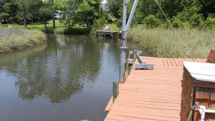 Custom-built Tempo Home. 2715 sq. ft., all brick three-car garage, 4 Bedroom, and 3 Baths. Waterfront Property with large dock on .86 acre in Tom King Estates off East Bay. This amazing property is unique because of the Location and features. Interior Features: formal dining, office, split and open floor plan, wood-burning fireplace, raised ceilings, ceiling fans, granite counter-tops, raised wrap-around breakfast bar, large walk-in pantry, dining room. Master with treyed ceiling separated from additional bedrooms. Tile in all wet areas. Upgraded plumbing fixtures, 5'' baseboards, crown molding. , All bedrooms save one, have walk-in closets. Extra 2-room suite could be used for a 5th bedroom with private entrance. Exterior: oversized 3-car garage, hip roof, 30 year dimensional roof.