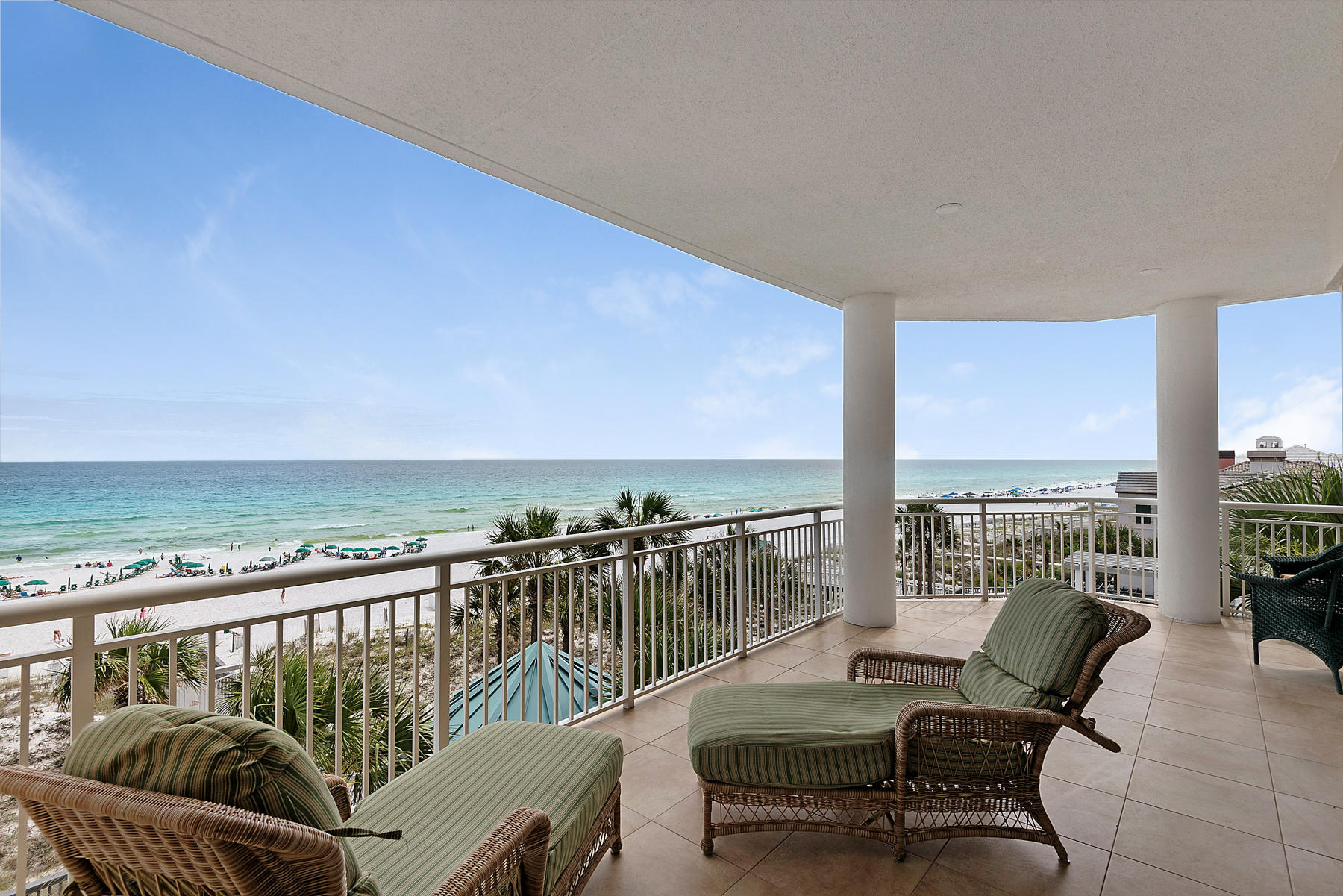 Enjoy luxury beach living and sweeping views from this lavish gulf front condominium. Soak in abundant sunshine and delight in watching the waves crash from the oversized balcony. Custom features of this home include an updated kitchen with dual ovens, gas cooktop, granite countertops and hammered copper sink. Floor to ceiling windows provide expansive vistas and the living areas offer low maintenance durable hardwood flooring. The enormous master bedroom provides breathtaking views and the master bath includes dual vanities with granite countertops and walk in shower with custom tile and three shower heads. You will feel right at home with walk-in closets, covered parking, and a pass through window from the kitchen to the outdoor gas grill. Grand Villas in Hidden Dunes