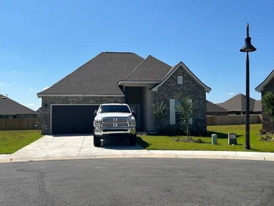 Located on a cul-de-sac lot the TRILLIUM IV B in The Bluffs at Lafayette community offers a 3 bedroom, 2 full bathroom open and split design. Upgrades added (list attached). Special Features: double vanity, garden tub, separate shower, and walk-in closet in master bath, master closet opens into laundry room for added convenience, kitchen island, walk-in pantry, covered front and rear porches, boot bench in mudroom, recessed lights, crown molding, framed mirrors, undermount sinks, landscaping, architectural 30-year shingles, flood lights, and more! Energy Efficient Features: tankless gas water heater, kitchen appliance package with gas range, vinyl low E windows, and more!