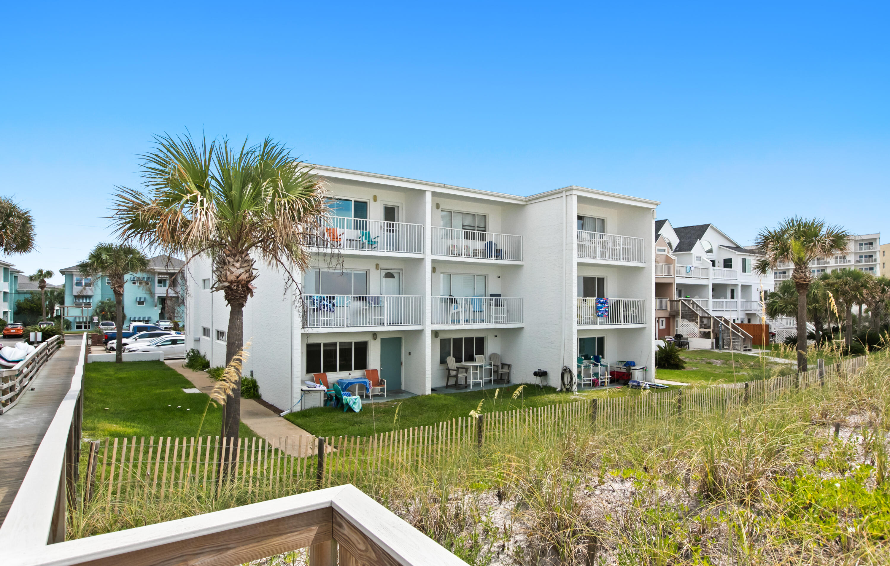 Welcome to Unit 7, where modern coastal living meets panoramic Gulf views! This fully renovated, fully furnished top-floor retreat offers the ultimate in seaside elegance.Step inside to discover spacious bedrooms, stainless steel appliances, custom interior window shutters, and a kitchen perfect for preparing gourmet meals or casual beachside snacks. The open-concept living and dining areas flow seamlessly, illuminated by natural light pouring in from windows that frame breathtaking Gulf views.Enjoy every sunrise and sunset from your large private balcony, with unobstructed panoramic views of the Gulf of Mexico. Privacy is paramount on the top floor, ensuring tranquil days and peaceful evenings. Convenience meets luxury with ample parking spaces and proximity to a newly opened restaurant, just a stroll away. Whether you're seeking a weekend getaway, a proven vacation rental investment, or a year-round coastal sanctuary, this unit offers it all.
Don't miss your chance to own a slice of Gulf-front paradise. Schedule your private tour today and experience the essence of beachside living at Unit 7.