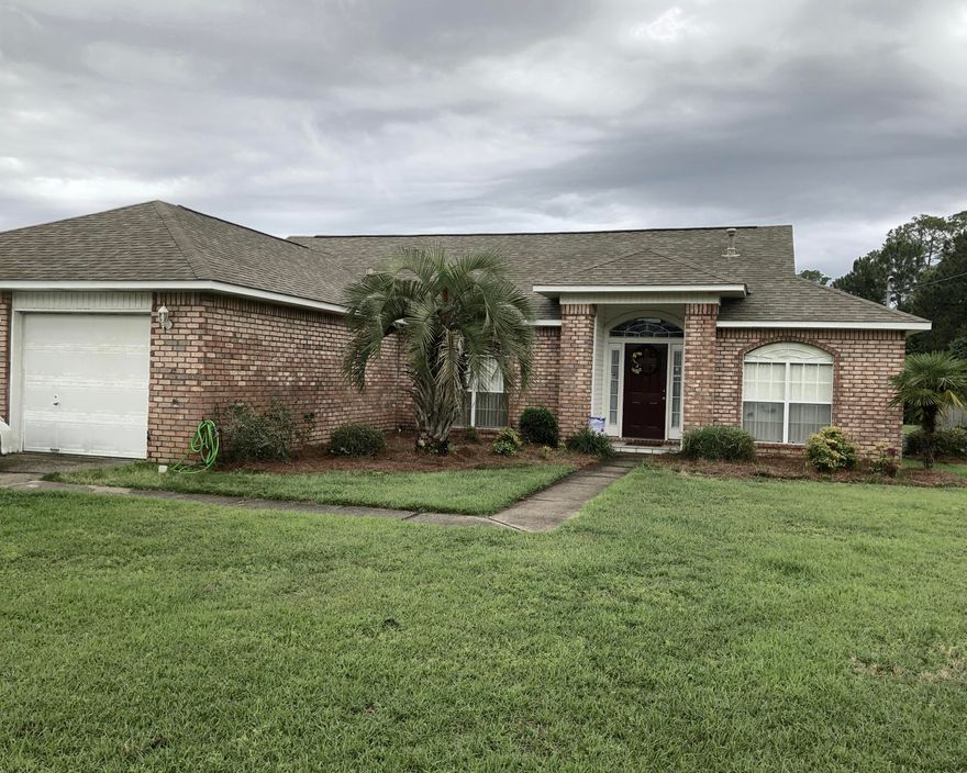 More pictures to come. Lovely 1 story, low maintenance, brick house ON THE LAKE!!! Houses in this neighborhood ON the lake do not come on the market very often. The huge kitchen boasts beautiful cabinets and lots of counter space. Sit in your screened in porch and enjoy the water view while drinking your morning coffee or reading a book. Current WDO bond and transferrable flood insurance policy in place. Roof replaced in 2011.