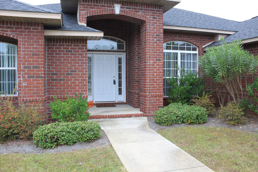 Fabulous all brick, 3/2, split floor plan with beautiful pool and view! This home features a fireplace, raised ceiling, open kitchen, large windows, and a huge master bedroom/sitting area and large bath. Come and see this lovely home today!