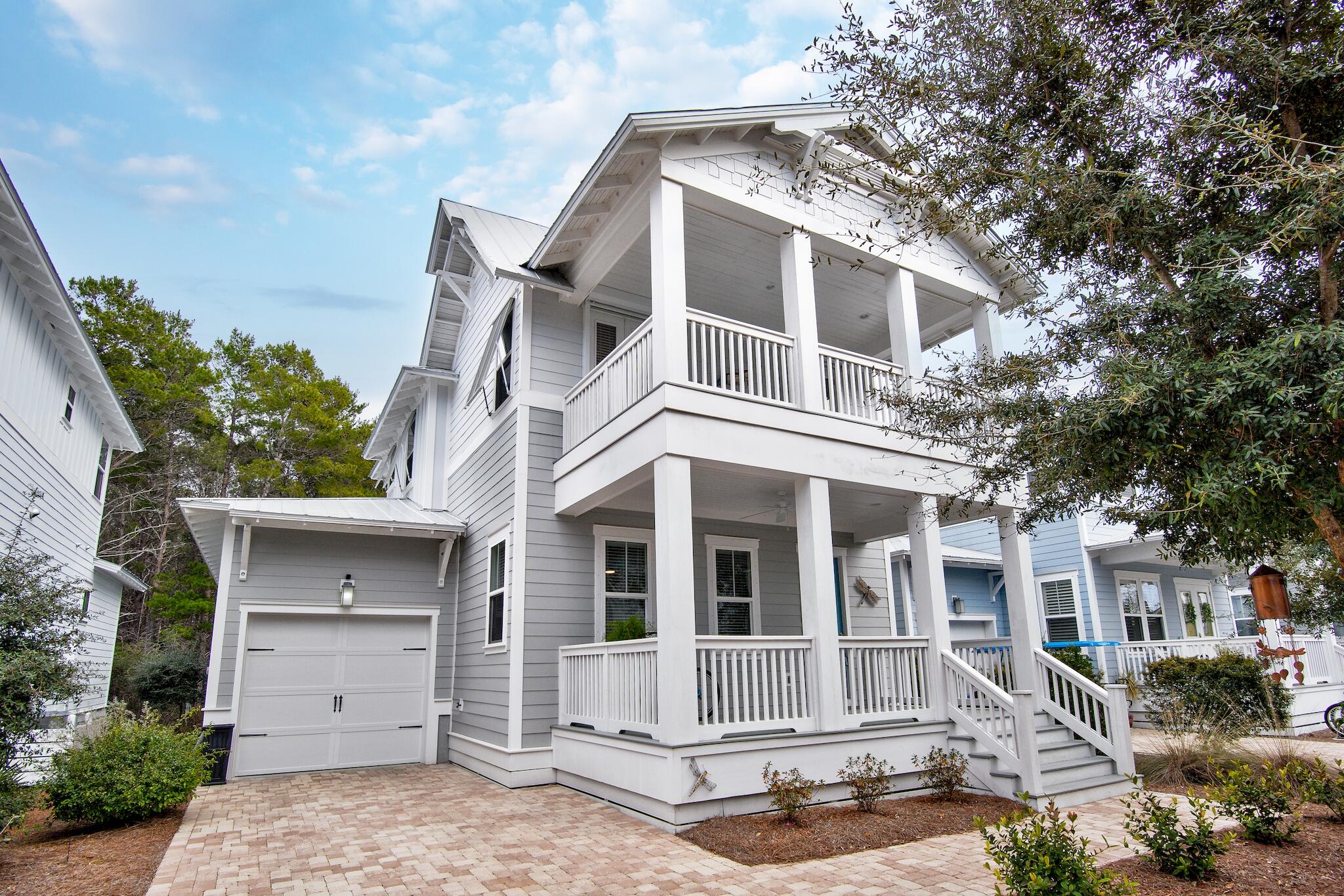 This custom built Harper Plan rarely comes on the market and is the jewel of Highland Parks. Offering top of the line upgrades including coffered ceilings, crown molding, board & batten paneled walls, wood flooring, and top of the line finishes. Beautiful hurricane shutters have been installed on the second floor providing extra protection. This 4 bedroom/4 bath home offers a first floor master, over 2,300 sf of living space, and more than 500 sf of outdoor patio space. Walk out your back screened in porch and onto the State Forest path to Blue Mountain Beach access - 10-12 minute walk. Home comes fully furnished with a few exceptions.