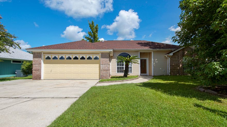 Welcome to your new home! This charming 3-bedroom, 2-bathroom house at 8111 Heritage Woods Lane offers a perfect blend of comfort and functionality. With 1,792 square feet of living space, this home features a split floor plan, providing privacy and convenience. The two distinct living areas offer flexibility for entertaining or relaxing. The kitchen is fully functional, offering a great foundation for any updates you may wish to add to create your dream cooking space. Enjoy the outdoors on the back patio, perfect for BBQs or relaxing with a book. The good-sized yard, complete with mature trees, provides a serene and private retreat, a rarity in the area. The 2-car garage offers ample space for parking and storage. The Callaway Rec Center is just half a mile away, offering a variety of activities and facilities. John B. Gore Park and Boat Ramp, only 2 miles from the house, provides Gulf access through East Bay, perfect for boating and fishing enthusiasts. Enjoy the freedom of a centrally located neighborhood with no HOA restrictions, allowing you to personalize your property as you see fit. This home is a fantastic opportunity to enjoy comfortable living in a prime location. With its spacious layout, new flooring, and excellent proximity to local amenities, 8111 Heritage Woods Lane is ready to welcome you. Don't miss your chance to make this house your home!