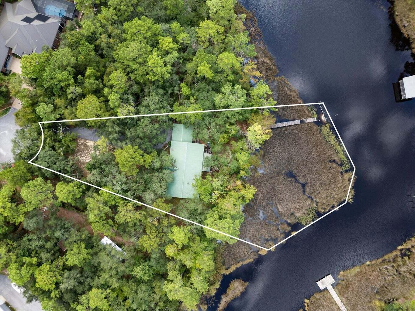 An Incredible Opportunity on Mallet Bayou!Tucked away on a peaceful cul-de-sac, this stunning .54-acre waterfront property boasts 50 feet of frontage on Mallet Bayou, offering deep water access and a true boater's paradise with easy entry to Choctawhatchee Bay.  Whether you're an investor or a dreamer ready to build your custom home, this property is your blank canvas. Framed by native Florida trees and lush natural surroundings, the setting is both tranquil and inspiring. The previous home of 2,600 sq ft has been gutted and is ready for updating or a total rebuild.  There is also a dock currently in place, but this will also need some updating.  Easy Show!!  The property is located in an AE Flood Zone.