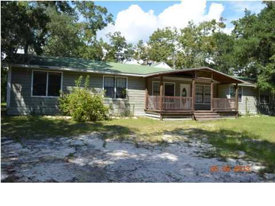 Even though this home may have been built in 1943, its charm and character certainly makes this home seem much more up to the times. A 5 bedroom 2 bath home, this all wood lap siding home needs some TLC but would make a fantastic home. The living room is over sized and nearly 700 square feet with beamed ceilings, wood siding and a huge fireplace. This home also comes with an updated galley kitchen, dining area, and indoor laundry. Just minutes from Niceville and Destin the large home is a must see to appreciate. Employees and family members residing with employees of JPMorgan Chase Bank, N.A., its affiliates or subsidiaries are strictly prohibited from directly or indirectly purchasing any property owned by JPMorgan Chase Bank, N.A.