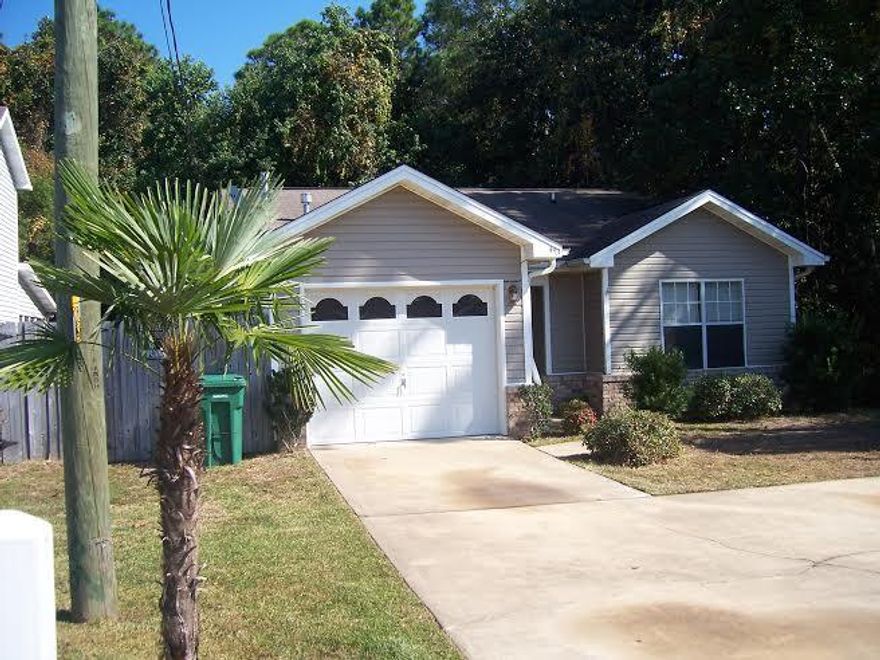 Great home with very large lot! It borders conservation area on right side & behind. 3 bedrooms, 2 baths, high ceilings, fireplace. Don't miss out on this one!!